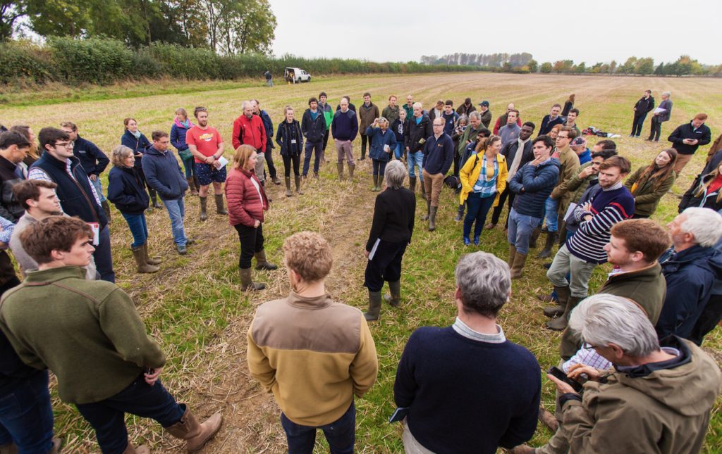 Field lab image of people standing in a field